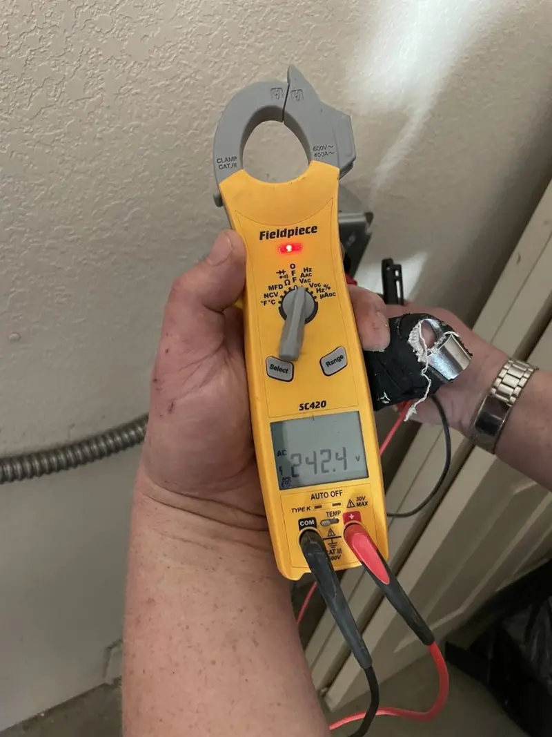 Voltage testing with clamp meter during Recessed Lighting Installation in Bolingbrook
